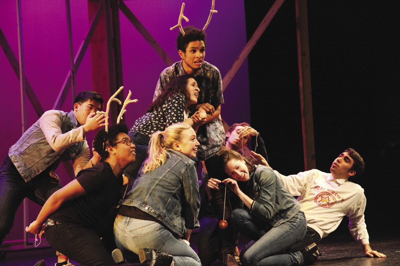 Students formed in a pyramid as part of a dance