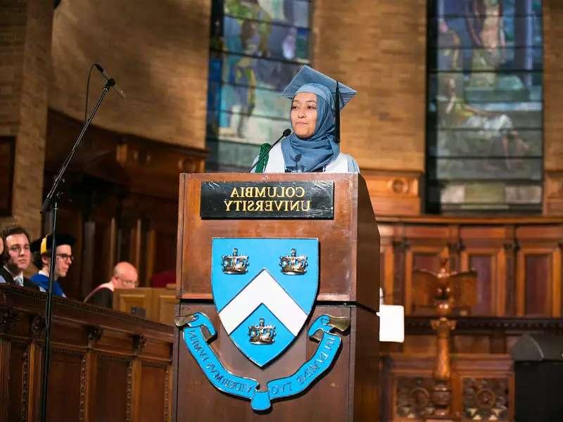 Grad speaking at podium